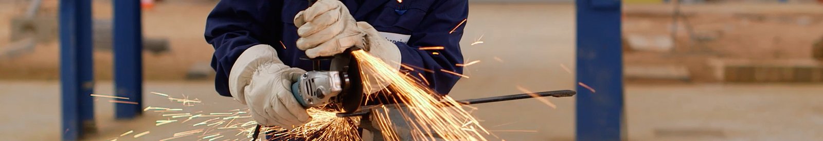 a man cutting-off a piece of metal with an angle grinder